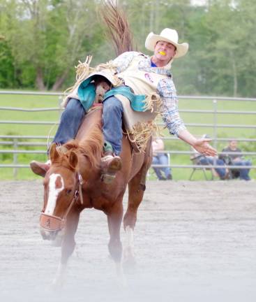 An angry horse carries it's rider towards the camera during the bareback riding event.