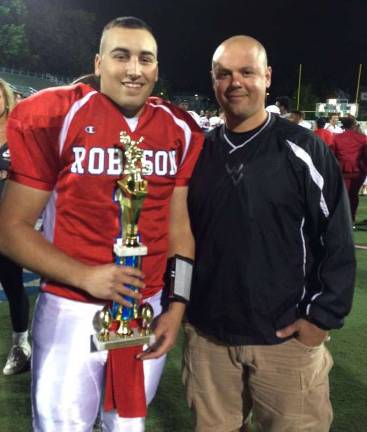 Marko Bakovic is shown with head coach Adam Vazquez.