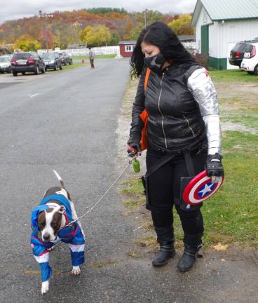 Captain America, portrayed by Cody, and his Winter Soldier mom, Andrea Obregon of Bayonne, are shown outside the Richards Building during the 4th Annual Dog Walk of the Dead. She learned about the event on Instgram.