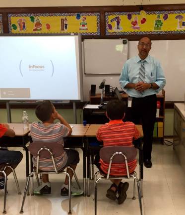 New Ogdensburg Superintendent Dave Astor talks to students on the first day of school.