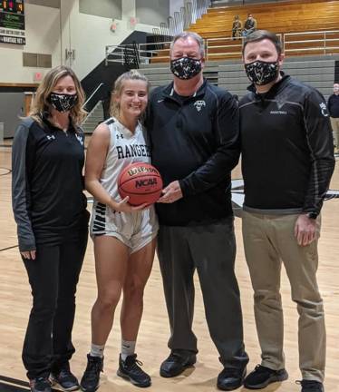 From left: assistant coach Mehgan Tobin, Samantha Opilla, head coach Earl Hornyak, and assistant coach Sean Neal