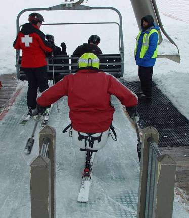 The plan to enter the sugar chair lift is tested by the PSIA adaptive instructor and Susanne Ebling.