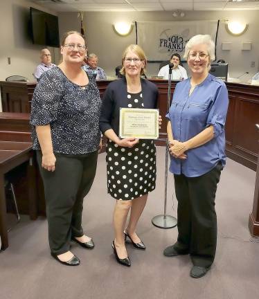 Weis Markets was presented with the September Business of Month Award by the Economic Development Committee. Vice Chairwoman Patti Carnes cited they were nominated because of all the things they do for the community including Stuff the Bus and Cram the Cruiser events.