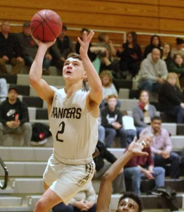 Wallkill Valley's Reyes Madera raises the ball towards the hoop during a shot in the first half. Madera scored 4 points, grabbed 4 rebounds and made 1 assist.