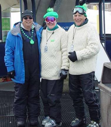 Cabriolet lift supervisor Robert Streszoff greets Buffy and John Whiting in their Irish dress on St. Patrick&#xfe;&#xc4;&#xf4;s Day.