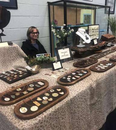 PHOTOS BY LAURIE GORDON Kim O'Hara, of Sparta, displays her artisan ceramic jewelry.