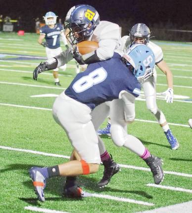 Sparta defensive back Noah Faria tackles Jefferson wide receiver Michael Studnick in the first half. Faria made 2 tackles and accomplished 1 interception.