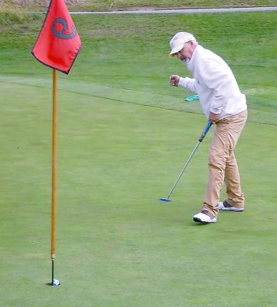 Anthony Ulacco sinks his birdie putt on the par 4 9th hole to capture the title of Senior Men’s Champion