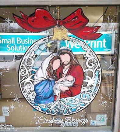 Artist gives businesses a boost with holiday paintings A painted holiday window at the UPS Store in Sparta (Photo by Laurie Gordon)