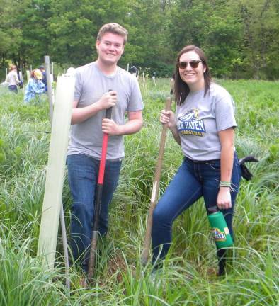 High Point class collaborates in tree planting High Point students Aidan Becker (left) and Ally Fairweather (right).
