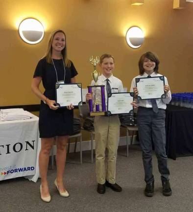 Enrichment class students honored Kelly Fedynich teacher, Jack Veith, and Jackson Moller with their award.