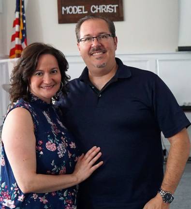 Photo by Vera Olinski Crossroads Church Pastor Anthony Gambino, right, stands with his wife, Jennifer, in the church.