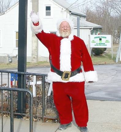 Keith “Santa” Collins encouraging visitors to celebrate a Christmas dinner and gifts at the Vernon VFW.