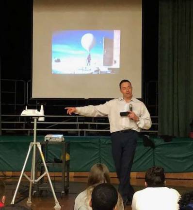 John Marhsall talks to an assembly at the Ogdensburg school.