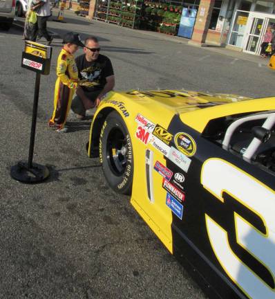 RoNetco raising money to fight hunger Mason and his father admire the race car at the Byram ShopRite.