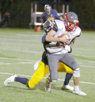 High Point ball carrier Jake Eutermarks is grabbed by a Jefferson defender in the second half