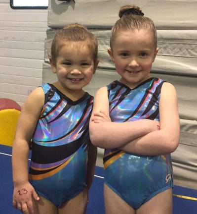 The competitive team sisters are Cooper Cotto and Broghan Lynch.