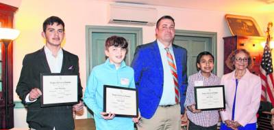 From left are essay contest winners Lucas Kozonasky, Bryce Yanoff and Jake Pando along with David Campagna, the 2024 Outstanding Teacher of American History, and Allyn Perry, chairwoman of the Chinkchewunska Chapter of the National Society Daughters of the American Revolution. (Photo provided)