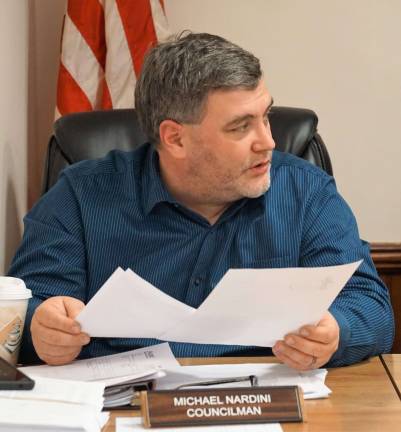 PHOTOS BY VERA OLINSKI Councilman Michael Nardini reviews water issues.