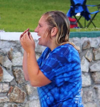 Ogdensburg Otter Coach Alexa Batelli goes to dry off after being thrown in Heater's Pond by her winning team.