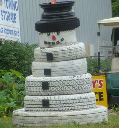 PHOTO BY JANET REDYKE This out-of-season snowman was spotted outside an auto repair shop on Route 94. Have we had enough of the hot, humid weather recently?