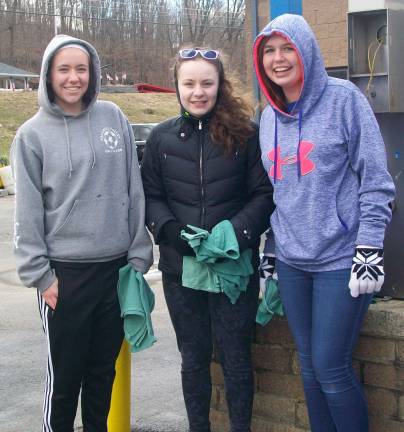 Wallkill Valley FBLA members Caitlin Gibson, Amanda Spindler, and Ana Schroeder get ready to dry off the next car during the FBLA fundraiser at the Wash &#xfe;&#xc4;&#xf2;N Lube Car Wash on April 4.