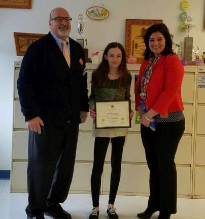 Pictured is the Sussex Caring Award winner for Lafayette Township Marie Elisa DeCollibus with Assistant Principal Gerard Fazzio and Superintendent Jennifer Cenatiempo.