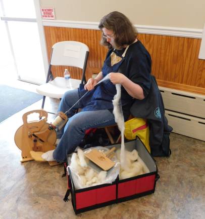 Patricia Mueller of Lake Hopatcong demonstrates spinning Cotswold sheep wool into yarn at the Sussex County Arts and Heritage Council's Artisan Fair, held Saturday, May 25, 2019 at the Byram Township Fire Department.&#xa0;(Photos by Mandy Coriston)