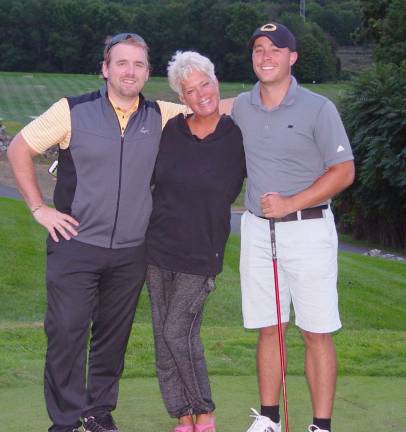 Men&#xfe;&#xc4;&#xf4;s Division Champion Owen Law gets congratulated by Mom &amp; Event Coordinator Dave Lurin