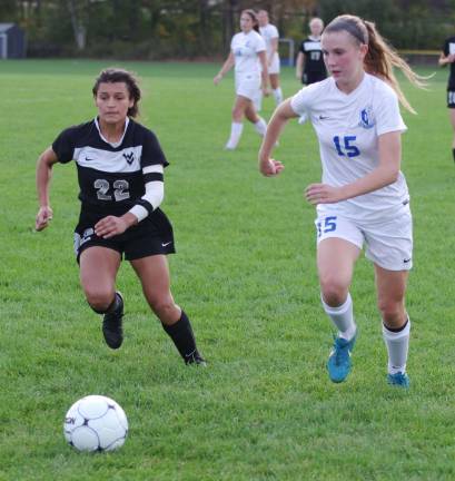 Wallkill Valley's Romane Calandreau and Kittatinny's Mackenzie Utter pursue the ball in the first period.