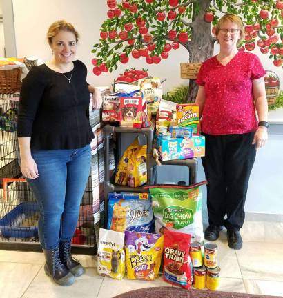 Members of the Don Bosco Columbiettes #7784 of Newton recently donated pet food and supplies to Father John&#xfe;&#xc4;&#xf4;s Animal Rescue in Lafayette. Shown in the picture are: Karen Yost of Father John&#xfe;&#xc4;&#xf4;s and Pat Keegan, President of the Don Bosco Columbiettes.