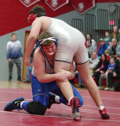 Kittatinny's Griffin Waldron grabs the leg of High Point's Thomas Hubmaster in the 285-pound weight class.