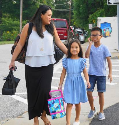 A family walks together to school.