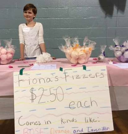 Franklin students hold TREP$ Marketplace Sixth-grade student Fiona Cummings sells her homemade bath bombs.