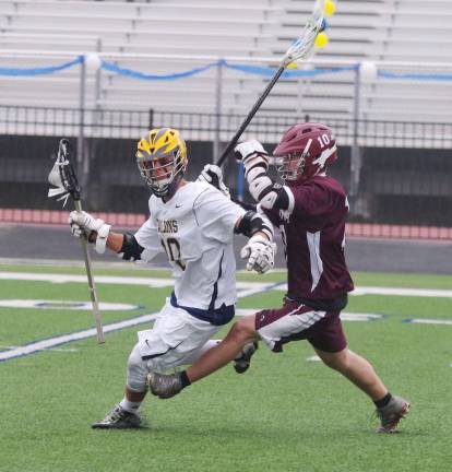 Jefferson tops Verona in lacrosse While carrying the ball Jefferson's Alex Leming is pursued by Verona's Doug Spardel.