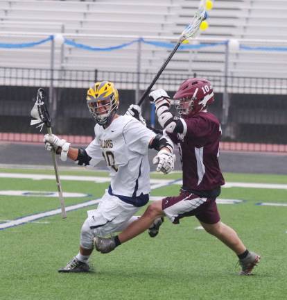 While carrying the ball Jefferson's Alex Leming is pursued by Verona's Doug Spardel.