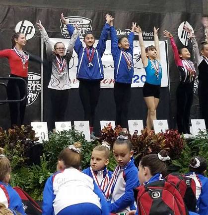 Garden Gators compete at Disney World Xcel Bronze Gators Arianna Frank of Glenwood in 2nd place and Ariana Begraft of Hampton in 4th for Floor exercise.