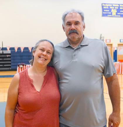 From left, Dawn and John Costello support their daughter