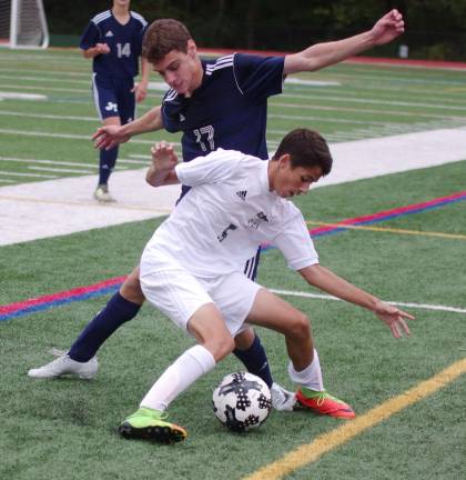 Morris Knolls' Alex Soares and Jefferson's Kyle Barbosa battle for control of the ball. Morris Knolls High School defeated Jefferson Township High School (Oak Ridge, N.J.) in boys varsity soccer on Sunday, October 8, 2017. The final score was 6-1. The Morris County Tournament, Quarterfinal Round took place at Morris Knolls High School in Rockaway, New Jersey.