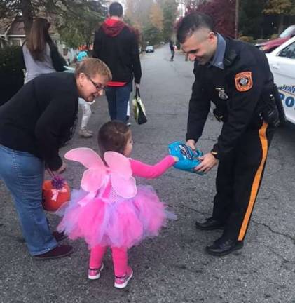 This photo provided by Linda Fierro of Hardsyton shows herself with her granddaughter and a helpful Hardyston Township police officer.