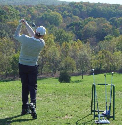 Golfer warms up at the Ballyowen Practice Range prior to competing in the Tullamore Hickory &amp; Scotch Tournament