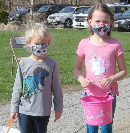 Patrick and Makenna Merner armed with baskets get ready for the rush (Photo by Janet Redyke)