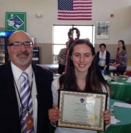 Lafayette Township School Assistant Principal Gerard Fazzio is shown with eighth-grader Grace Stockmal, the recipient of the 2014 caring award.