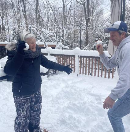 SN2 Alice Kimble, 99, of Sparta has a snowball fight with her son Fred. (Photo provided)