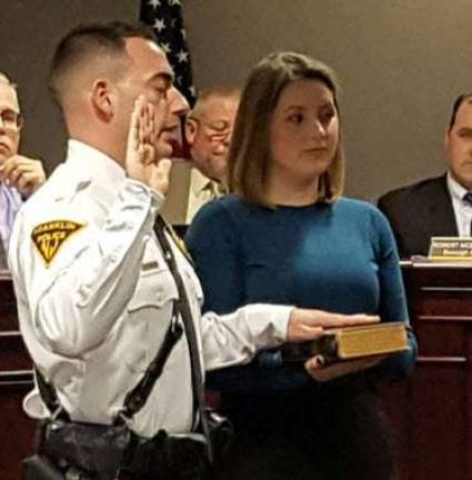 New Franklin police officers sworn in Chief of Police Gregory Cugliari taking the Oath of Office.