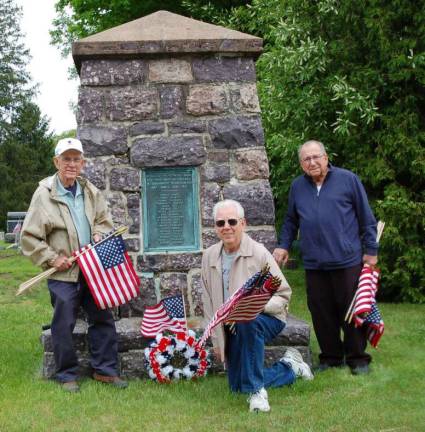 Members of the American Post 423 of Jefferson Township prepare to decorate the graves of Veterans in the Oak Ridge Presbyterian Cemetery for Memorial Day. Shown are Service Officer Joe Mikowski, Nick Cokinos and Ed Battaglia. The monument behind them lists the names of those who served in World War I from the area.
