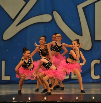 Dance Expression dancers perform at Kids Artistic Review Grease dancers in their final pose