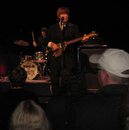 PHOTO BY JANET REDYKE 1964, a Beatles tribute band, rocked the Newton Theater on October 13.