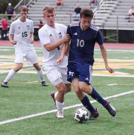 Jefferson's Zackary Hirschman maneuvers the ball while covered by Morris Knolls Andrew Sceurman.