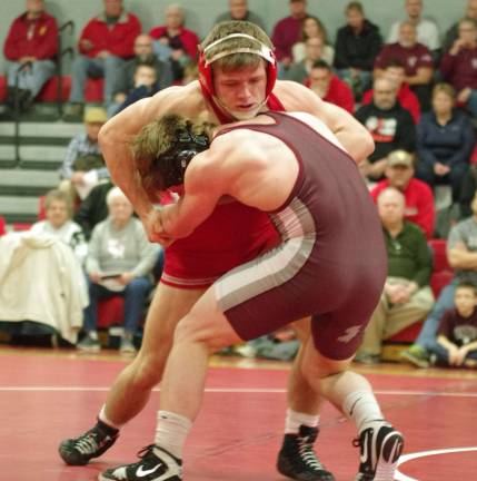 High Point's Billy Talmadge wrestles with Phillipsburg's Kyle Tino (foreground). Talmadge defeated Tino in the 145 pound match by decision 12-8.